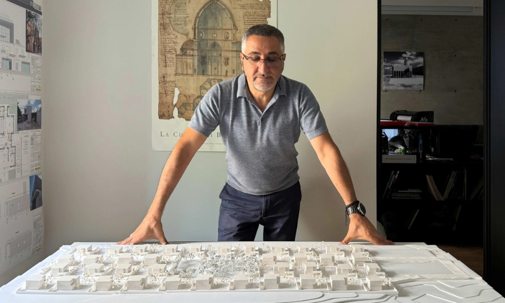 E-Studio architect presenting an urban planning model